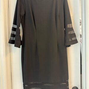 Discounted Shipping by Posh
Sami & Jo Black Dress with Sheer Sleeve Details